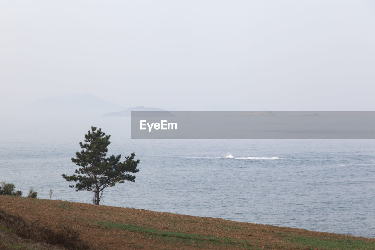 SCENIC VIEW OF SEA AND MOUNTAINS