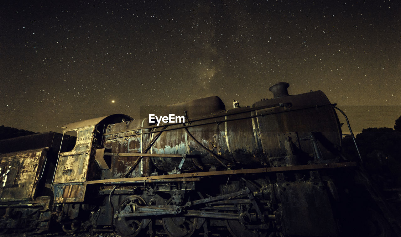 Old locomotive with and milky way