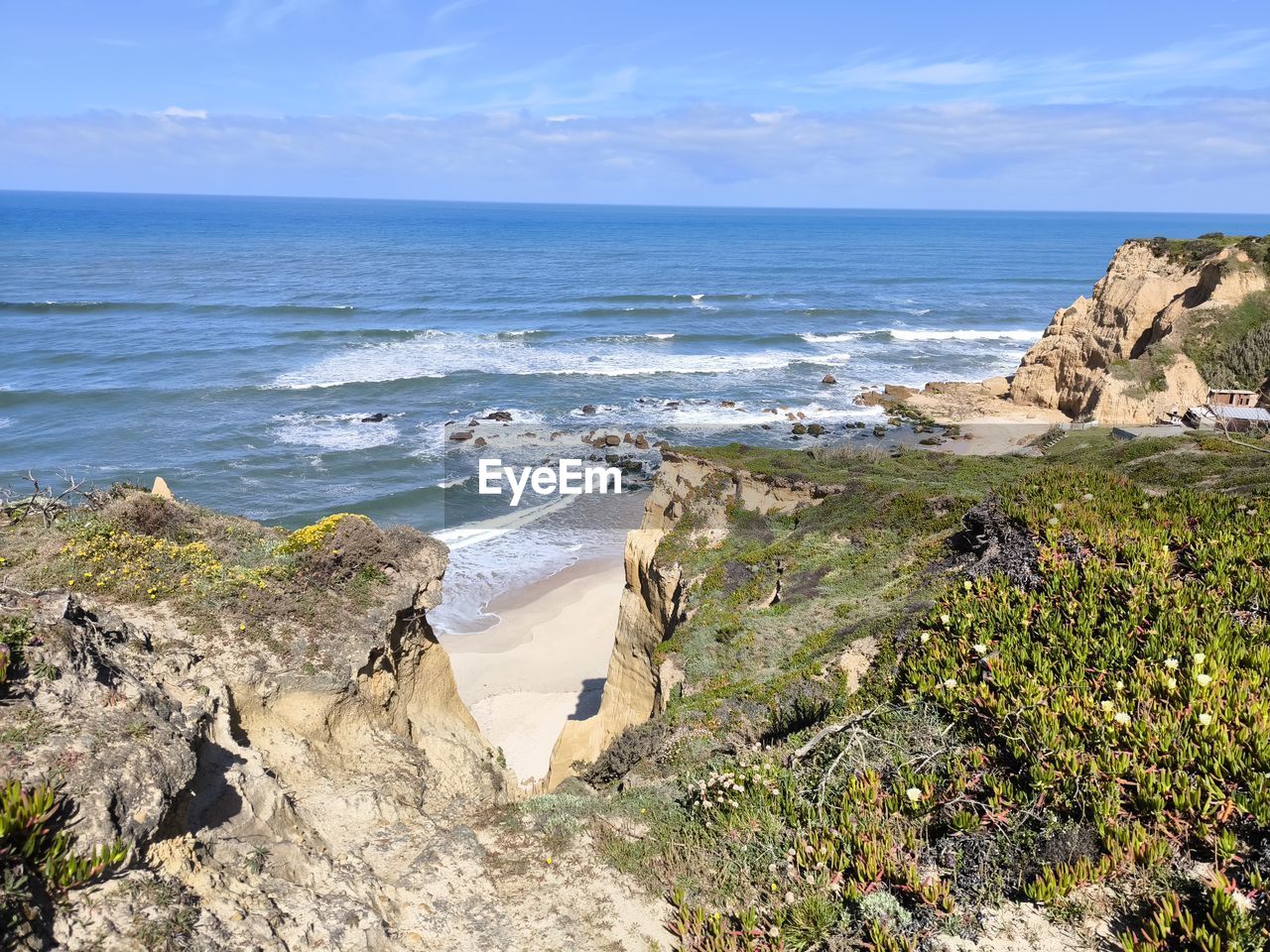 sea, water, land, beach, sky, cliff, scenics - nature, beauty in nature, vacation, coast, rock, nature, shore, body of water, horizon over water, ocean, horizon, terrain, cove, wave, coastline, travel destinations, day, tranquility, plant, travel, no people, motion, tranquil scene, bay, environment, outdoors, cloud, sports, tourism, landscape, blue, water sports, sand, idyllic, non-urban scene, sunlight, holiday, rock formation