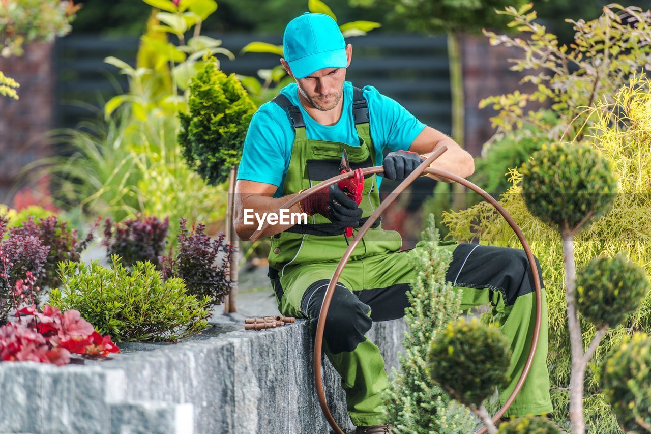 MAN WORKING ON PLANT