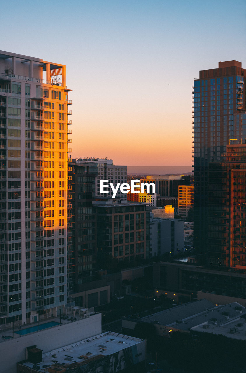 modern buildings in city at dusk