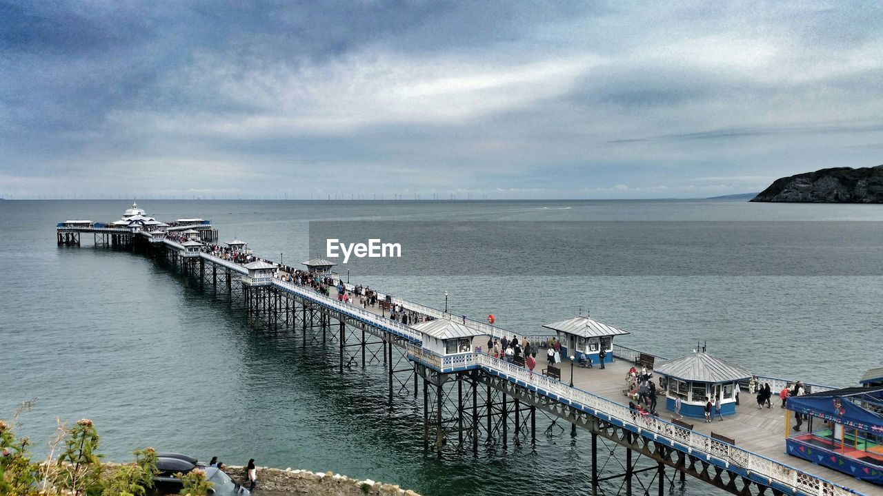 High angle view of pier over sea against cloudy sky