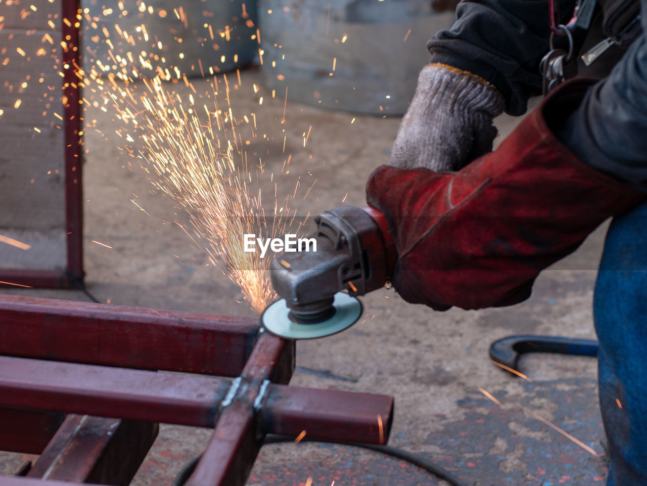 Close-up of worker welding metal