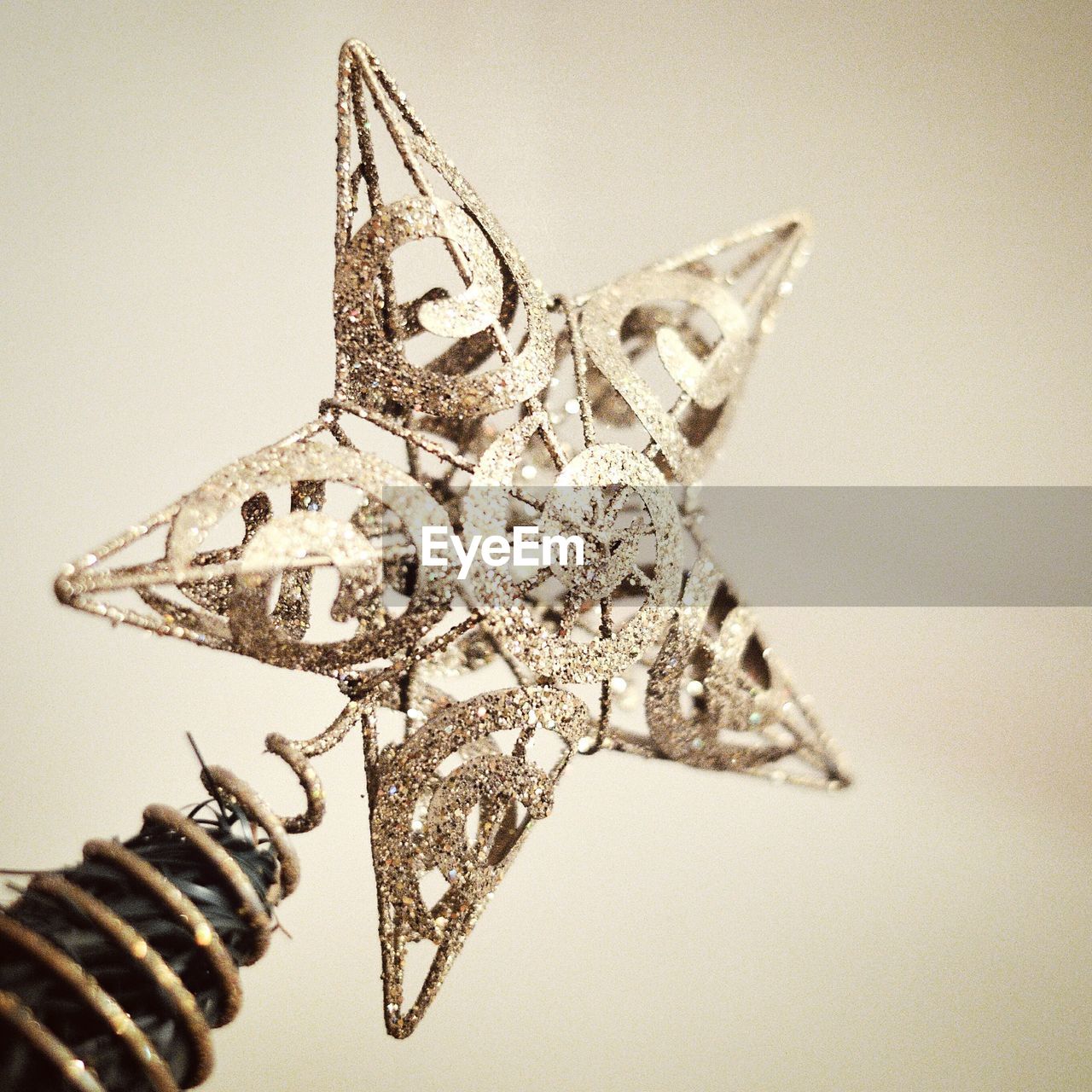 CLOSE-UP OF CHRISTMAS ORNAMENTS ON WALL