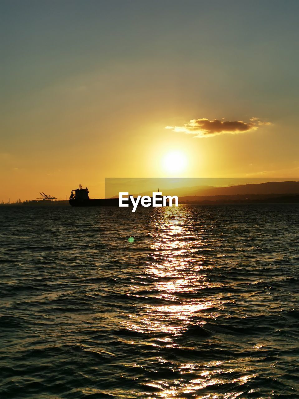 SCENIC VIEW OF SEA AGAINST ORANGE SKY DURING SUNSET