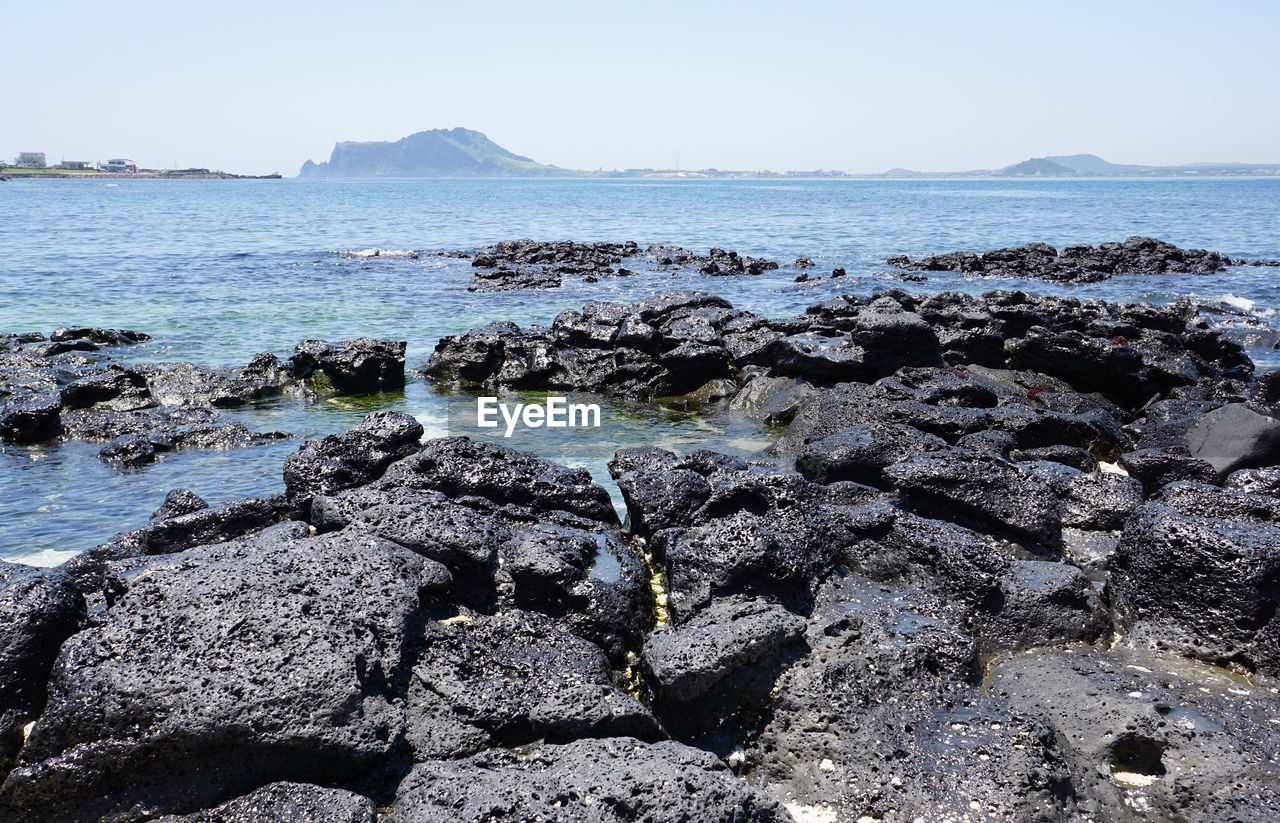 Scenic view of sea against clear sky