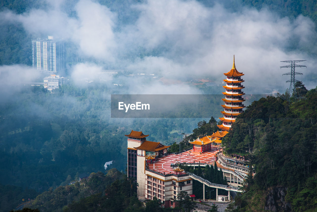 Aerial view of buddhist temple in a forest located in genting highland, malaysia