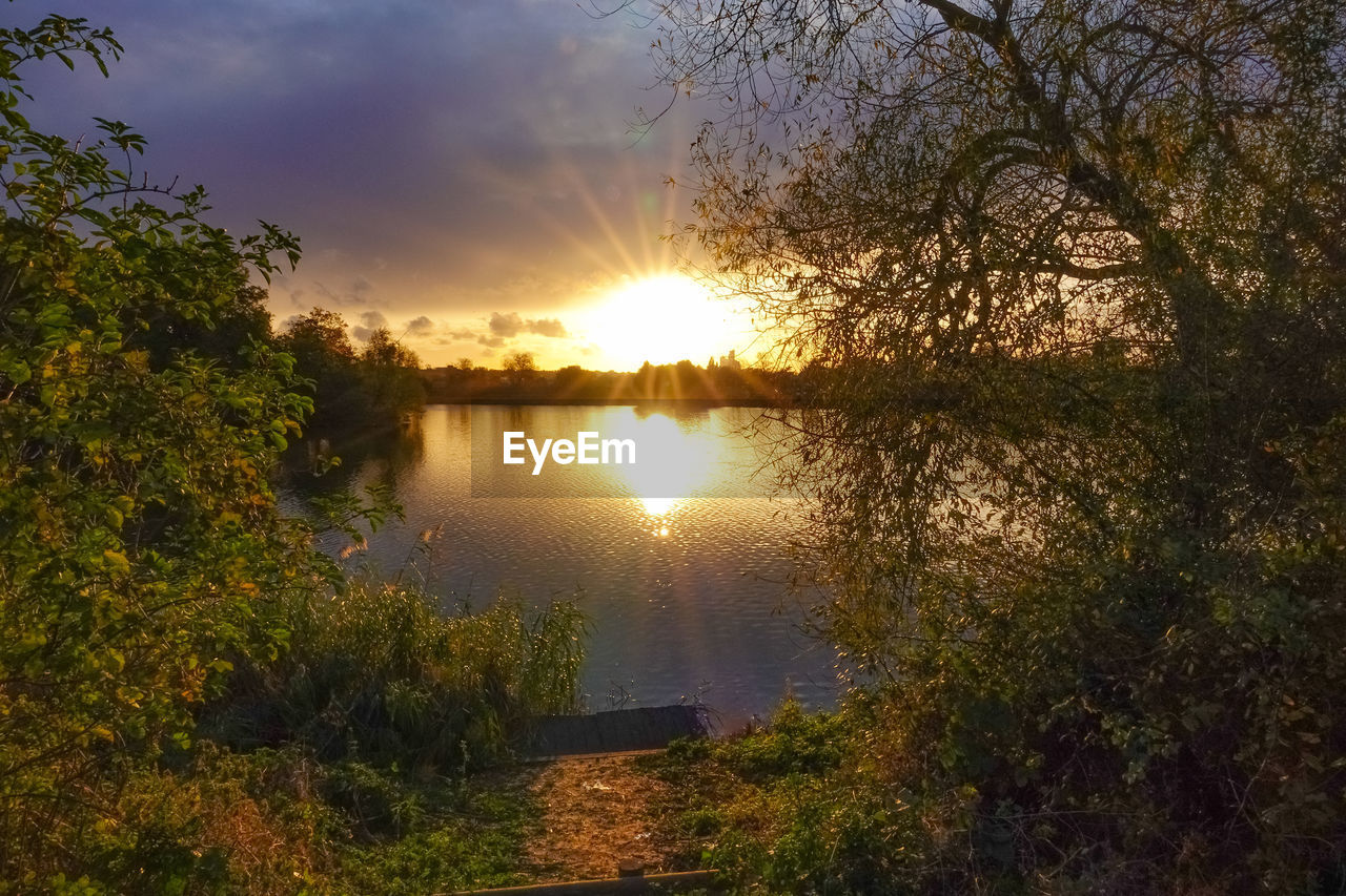 SCENIC VIEW OF LAKE DURING SUNSET