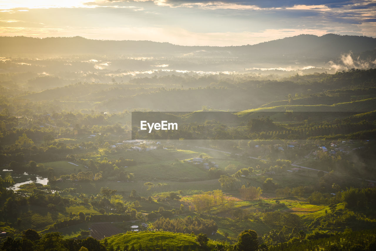 Aerial view of townscape against sky during sunset