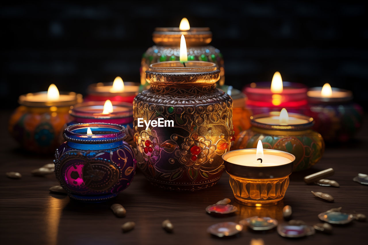 close-up of illuminated tea light on table