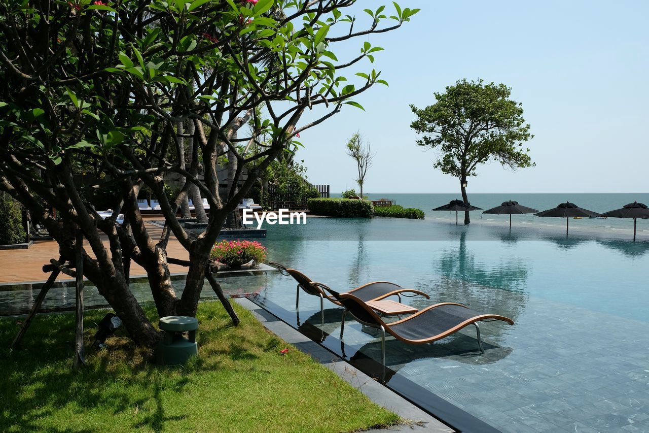 Lounge chairs at infinity pool