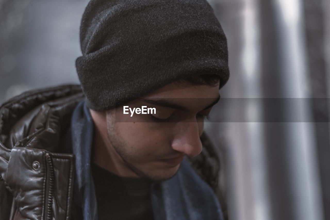 Close-up of thoughtful young man looking away