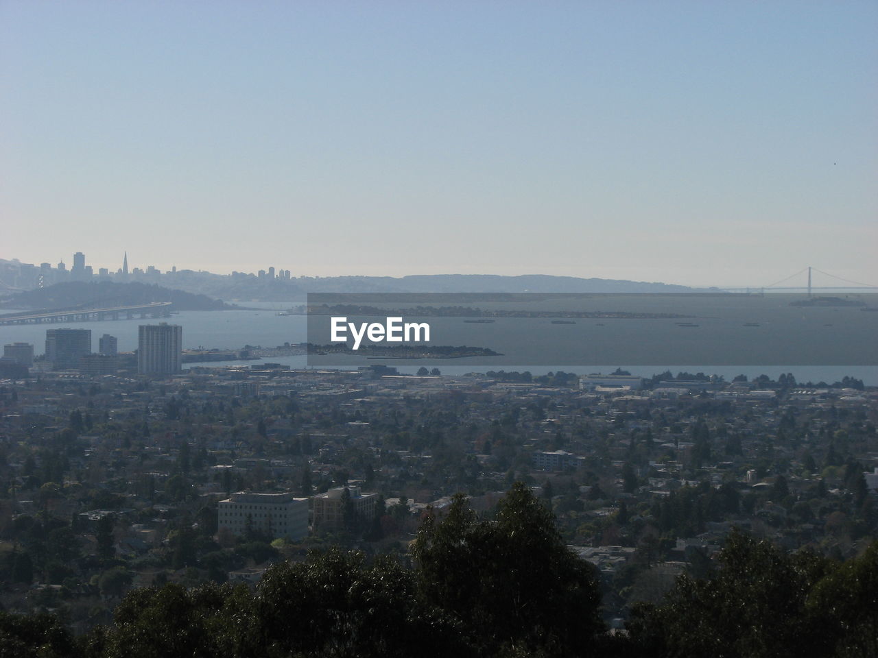 HIGH ANGLE VIEW OF CITYSCAPE AGAINST CLEAR SKY