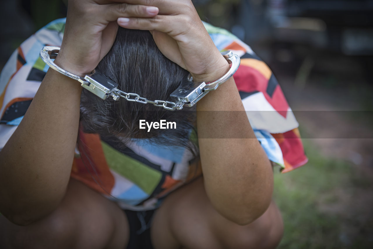 Close up. hands are handcuffed. captured prisoner or terrorist, close-up of hands in handcuffs.