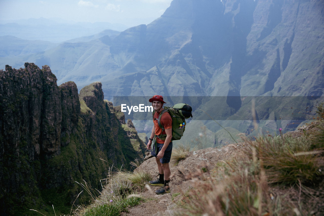 Rear view of man walking on mountain