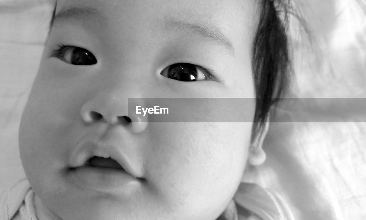 Close-up high angle portrait of cute baby girl