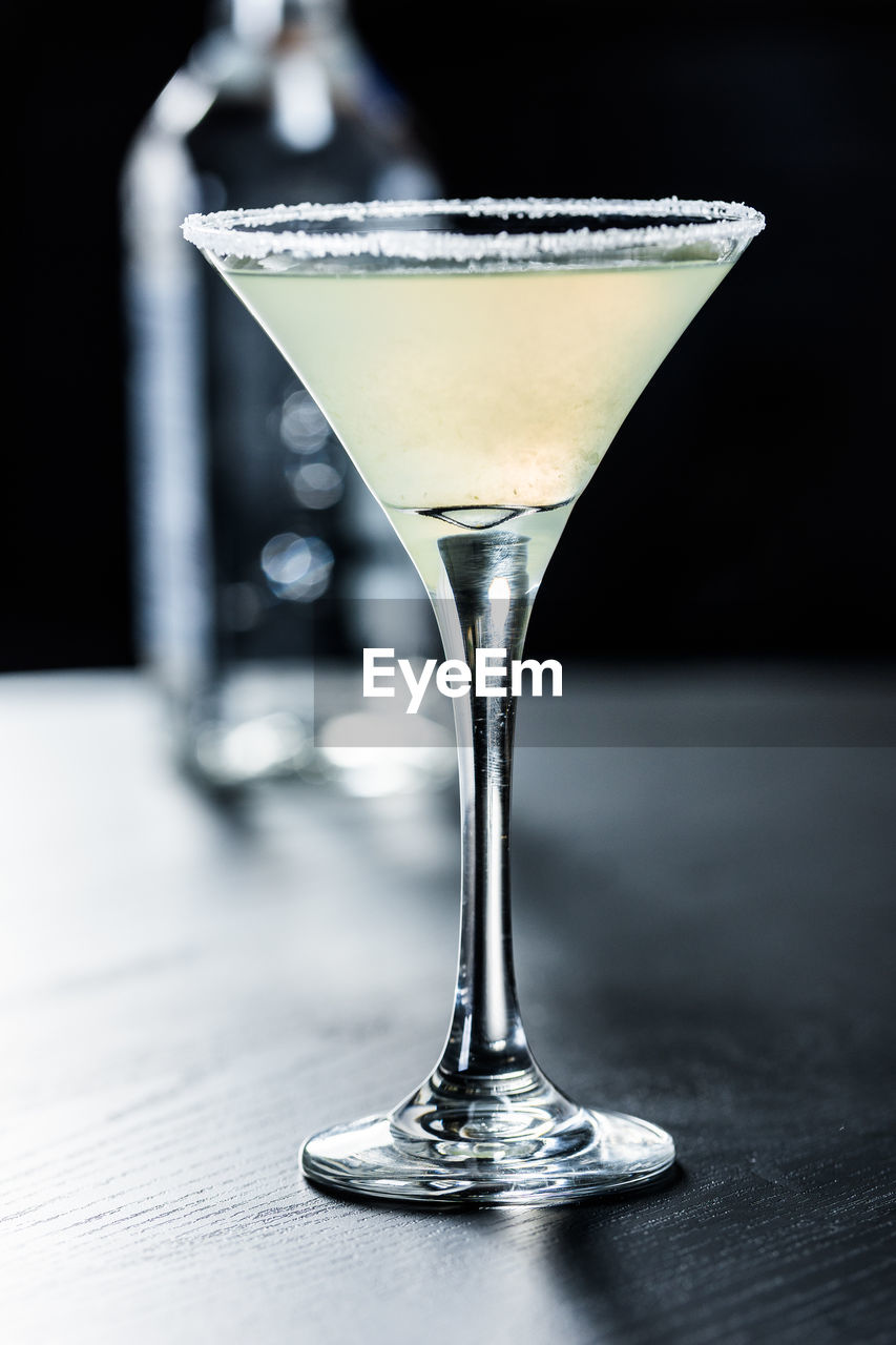 cocktail, martini glass, food and drink, martini, alcohol, glass, refreshment, drink, alcoholic beverage, distilled beverage, food, indoors, drinking glass, no people, fruit, close-up, still life, household equipment, olive, bar, studio shot, single object