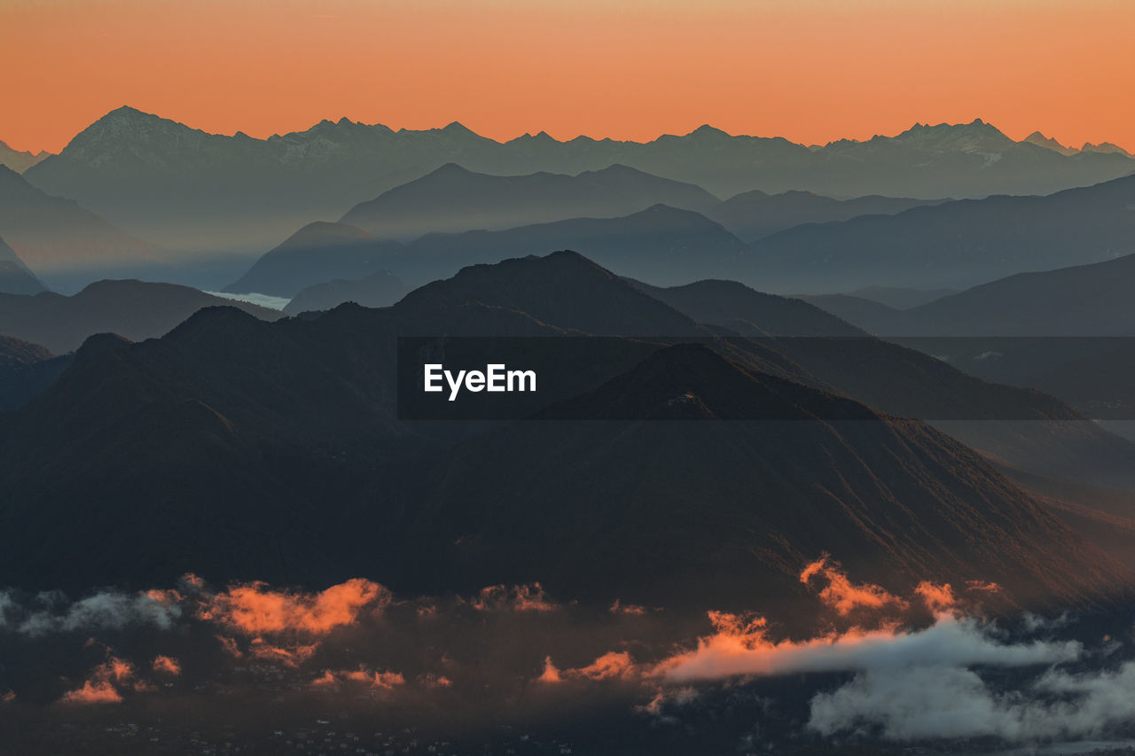 Scenic view of mountains against sky during sunset