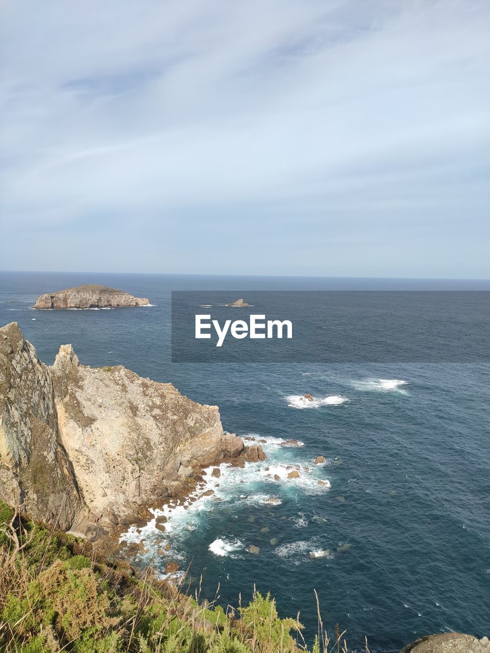 water, cliff, nature, sea, beauty in nature, terrain, scenics - nature, day, rock, no people, tranquility, land, high angle view, outdoors, tranquil scene, mountain, beach, reflection, sky, plant, sunlight, rock formation, non-urban scene, coast, idyllic, cloud, panoramic, travel