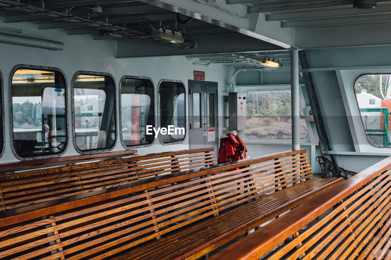 Wooden benches on deck of pacific northwest, washington state ferry boat