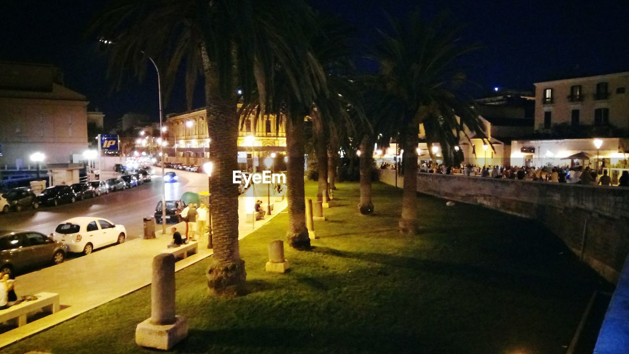 VIEW OF CITY STREET AT NIGHT