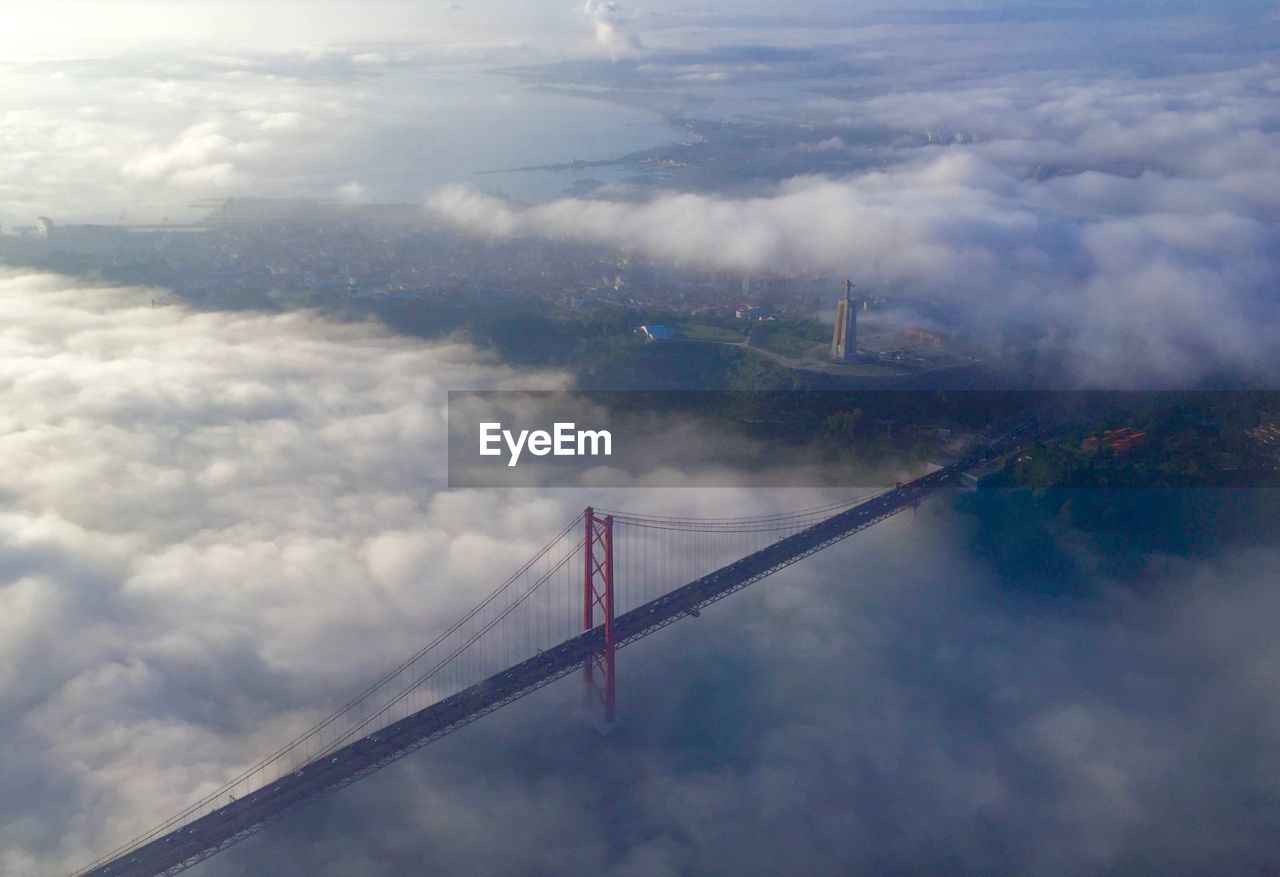 Aerial view of golden gate bridge covered with clouds