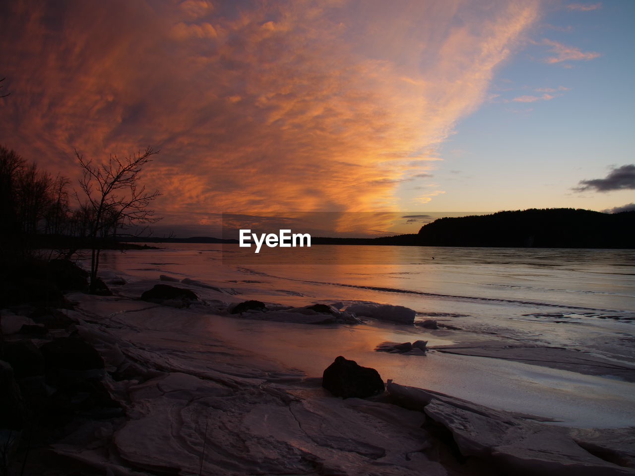 Scenic view of landscape against sky during sunset