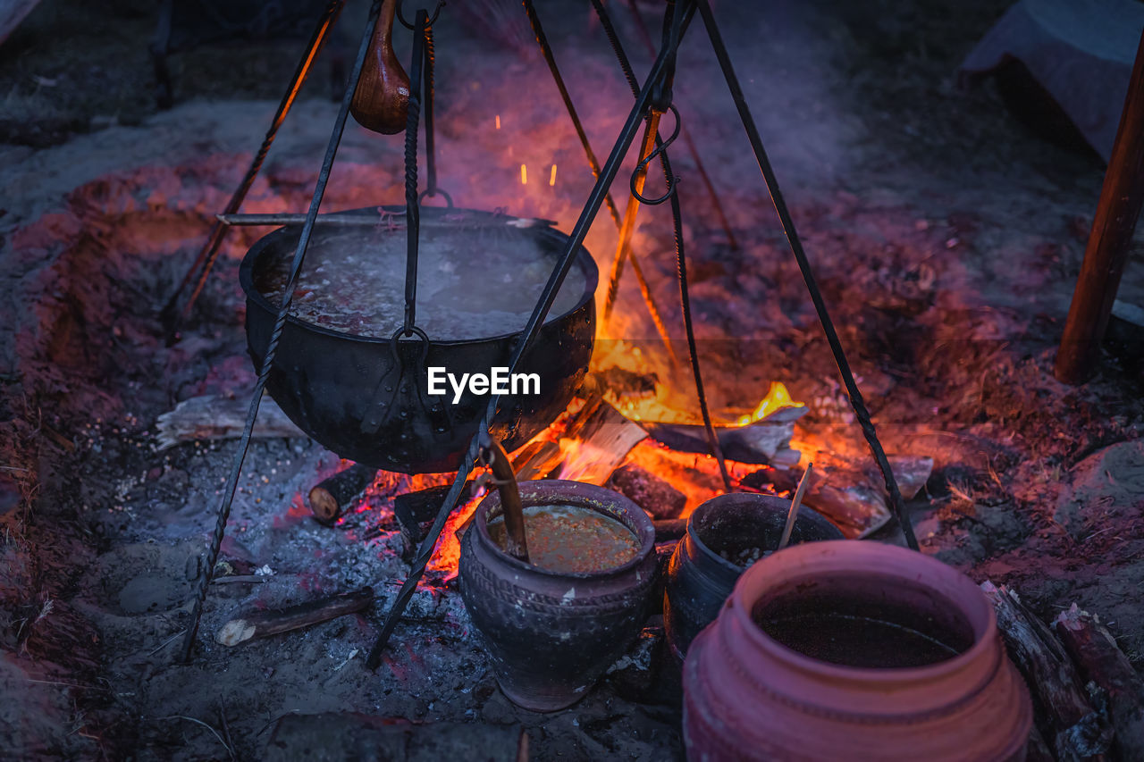 HIGH ANGLE VIEW OF FIRE ON BARBECUE