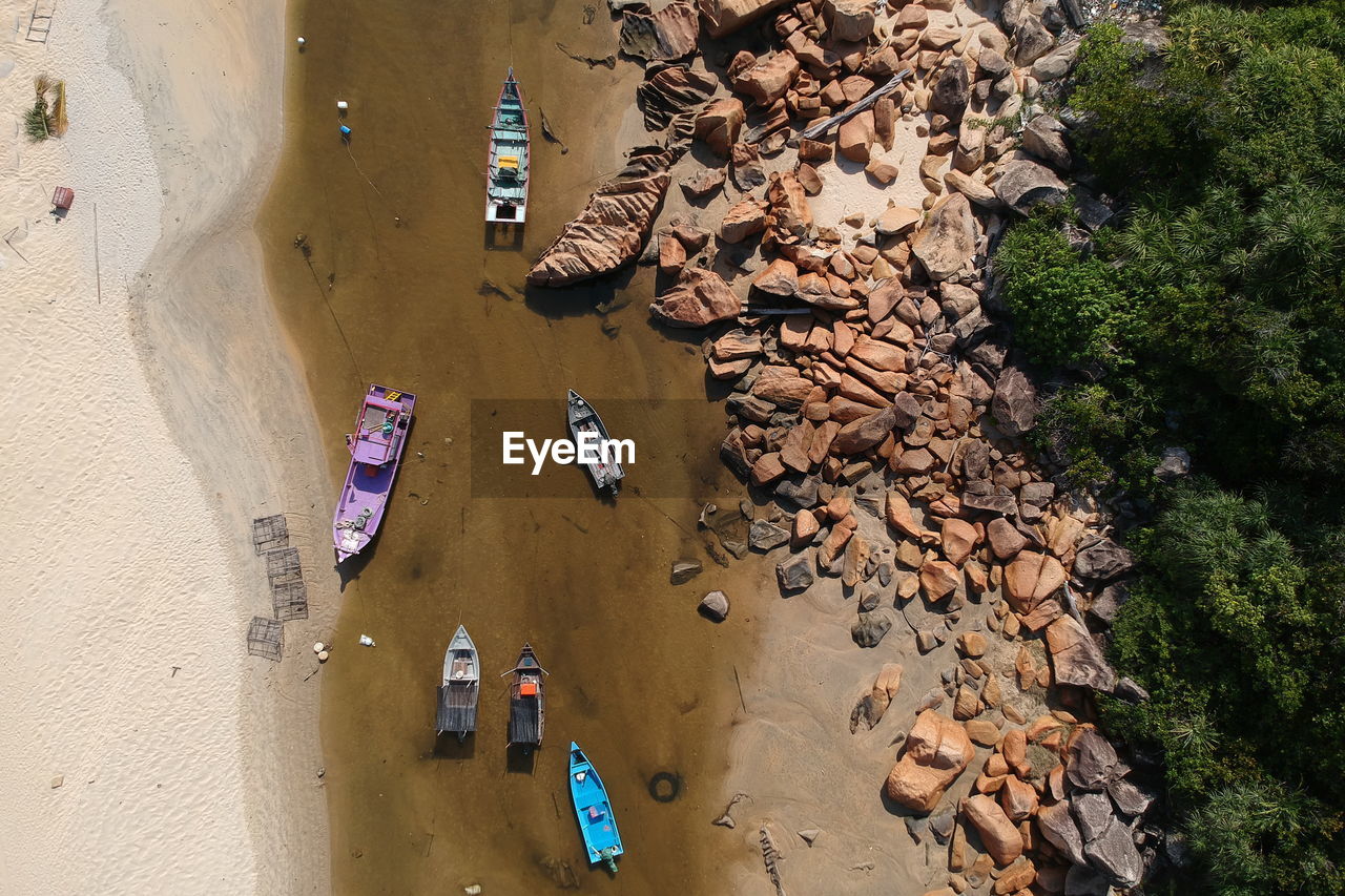 Boats moored at beach