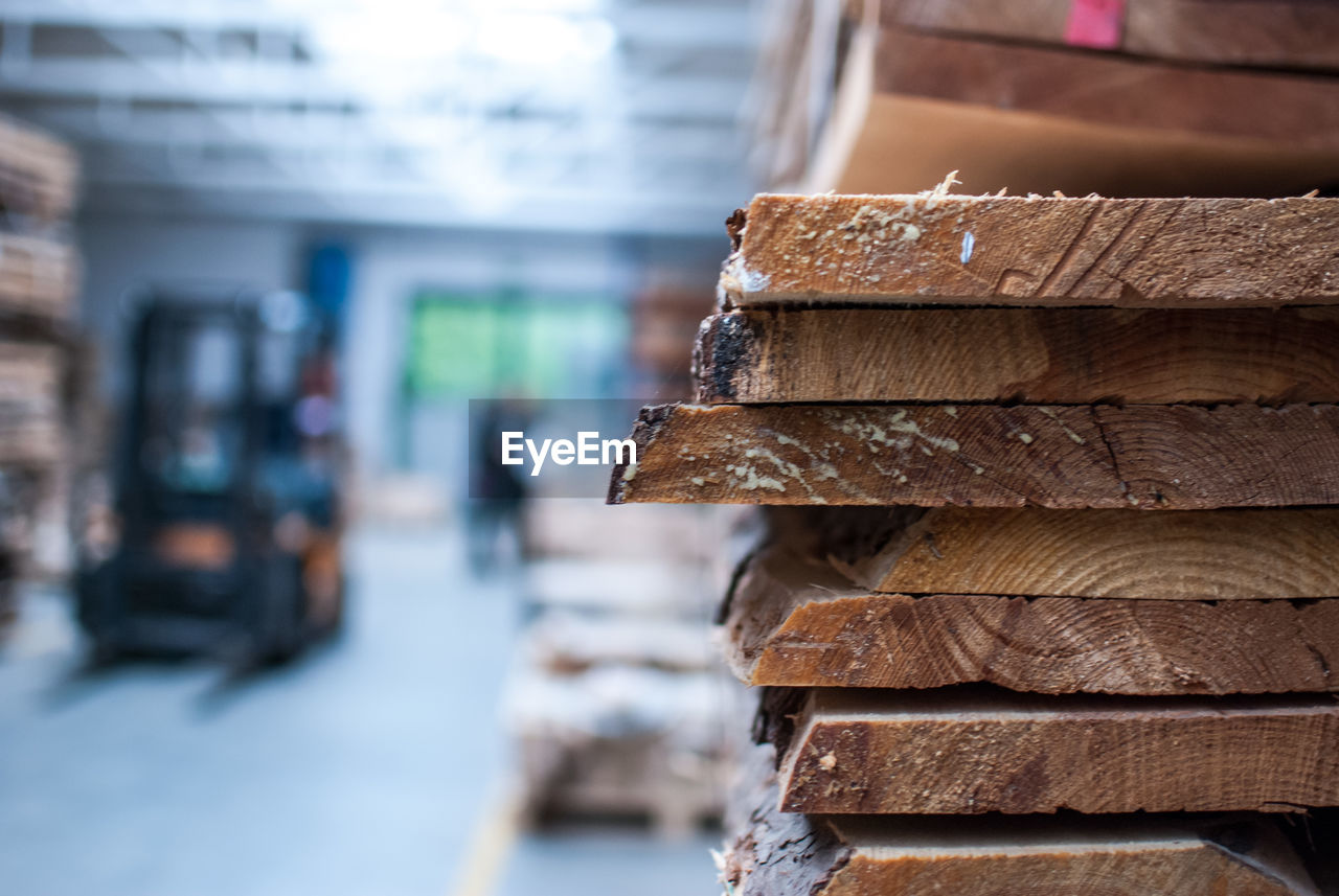 Close-up of stacked woods in factory