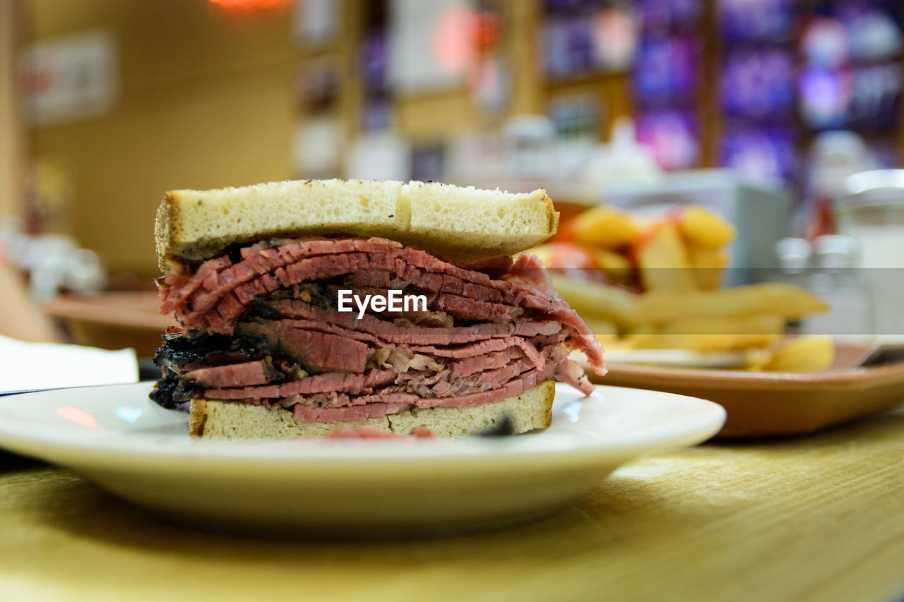 Close-up pastrami sandwich on plate