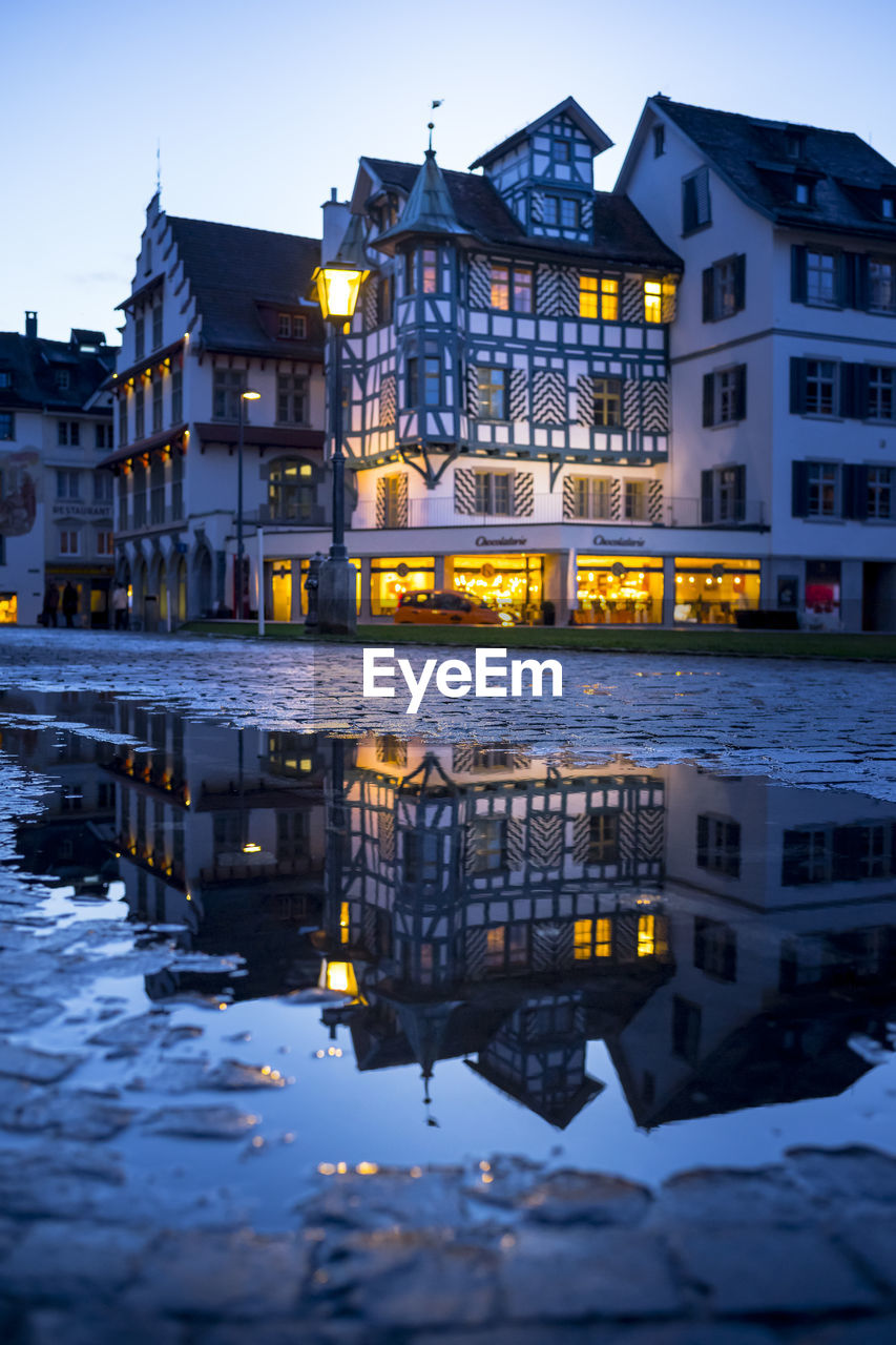 REFLECTION OF ILLUMINATED BUILDINGS IN CITY