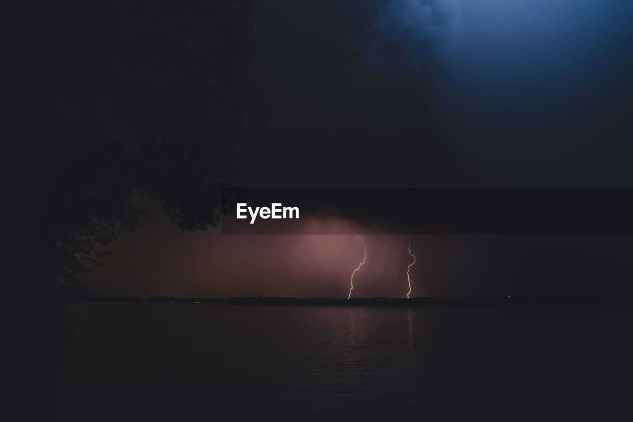 Scenic view of sea against sky at night