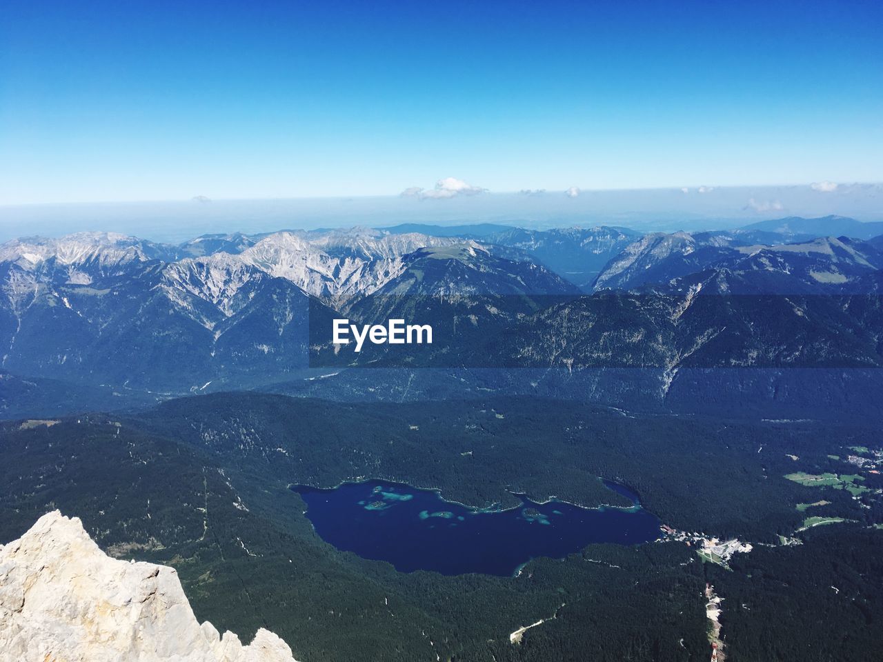 HIGH ANGLE VIEW OF MOUNTAIN RANGE AGAINST CLEAR BLUE SKY