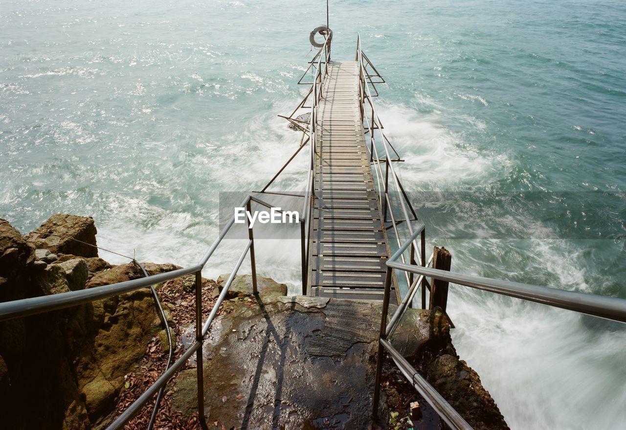 High angle view of staircase by sea