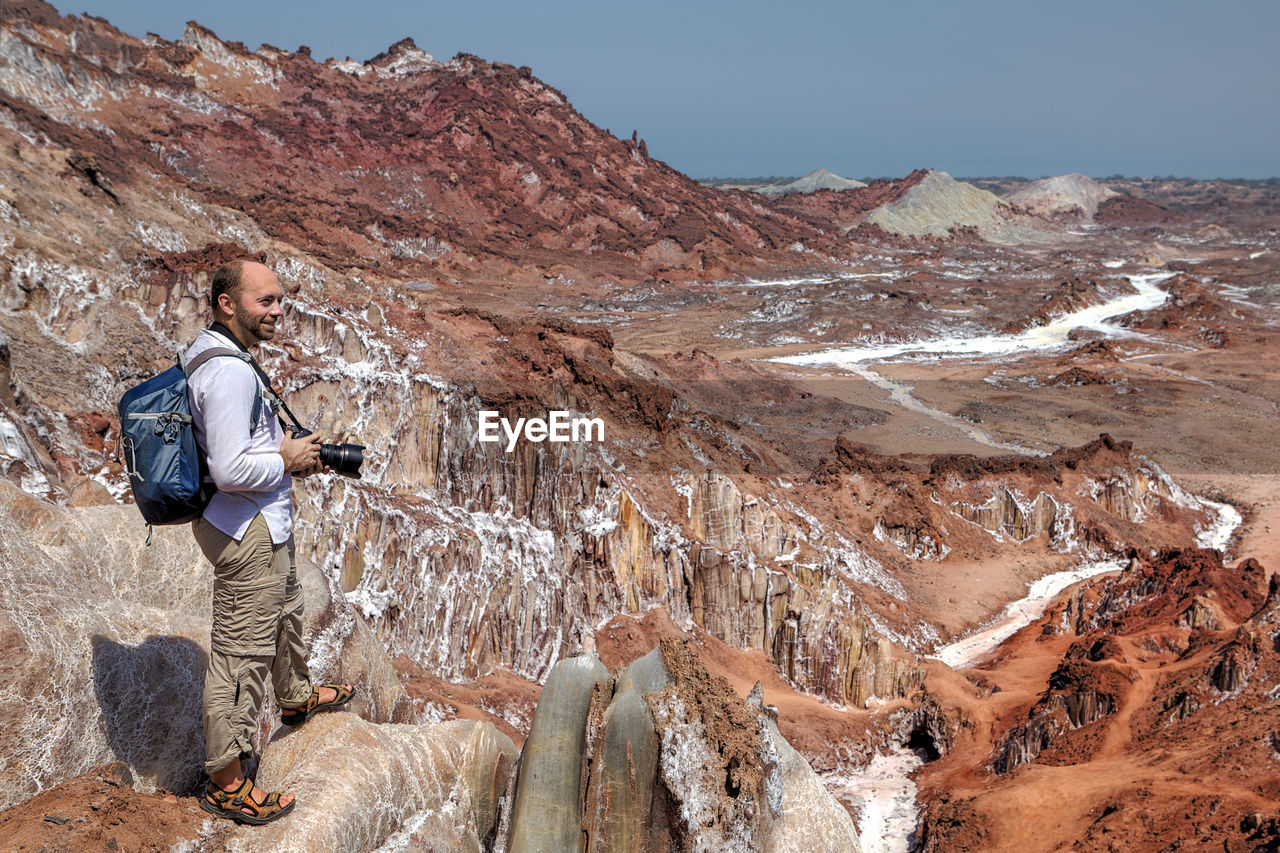 Man standing on rock formations