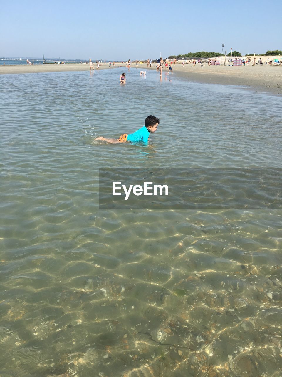 BOY SWIMMING IN SEA