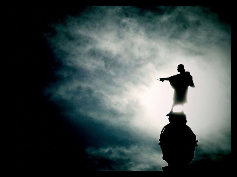 Low angle view of statue against cloudy sky