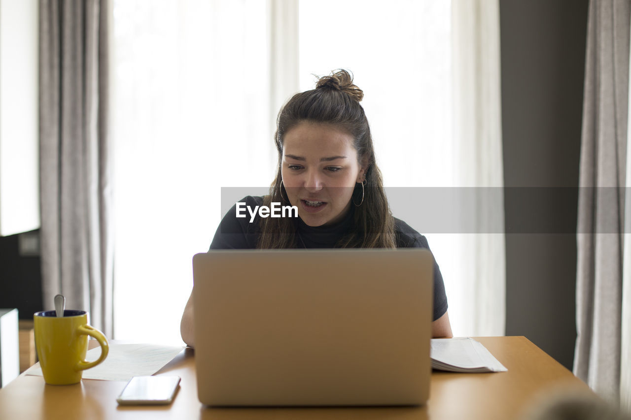 A student taking an online class from home