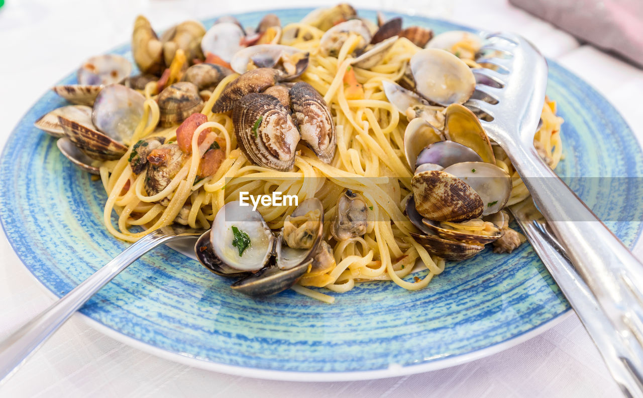 High angle view of spaghetti with clams on plate