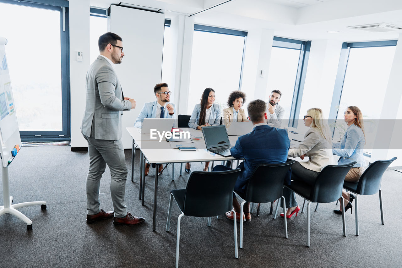 Business colleagues discussing during meeting in office