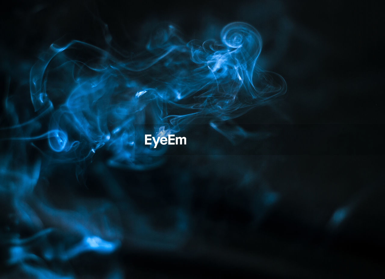 Close-up of smoke against black background