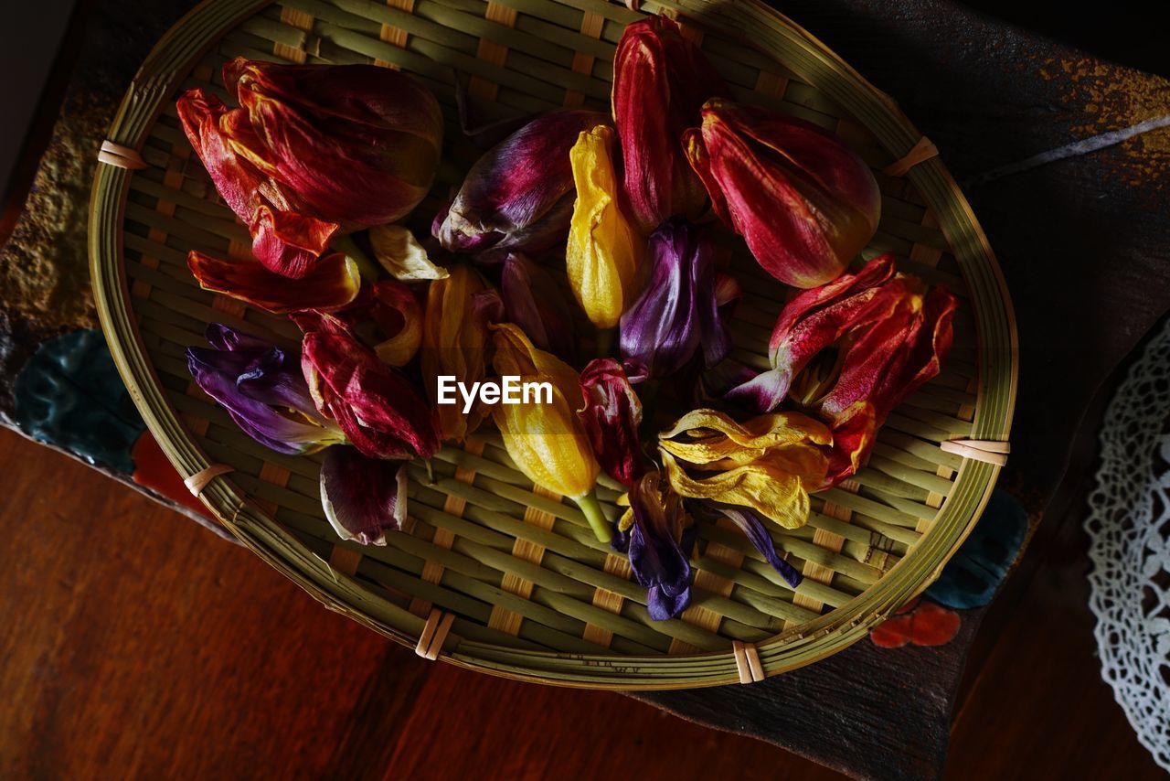 Directly above shot of dried flowers in basket on table