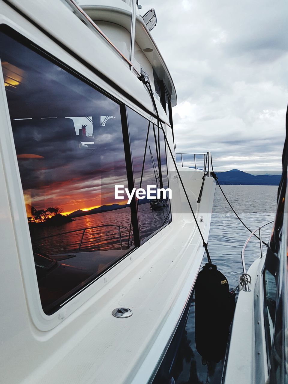 Yachts on sea against sky