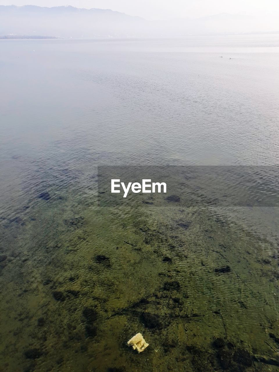 HIGH ANGLE VIEW OF BEACH AGAINST SKY