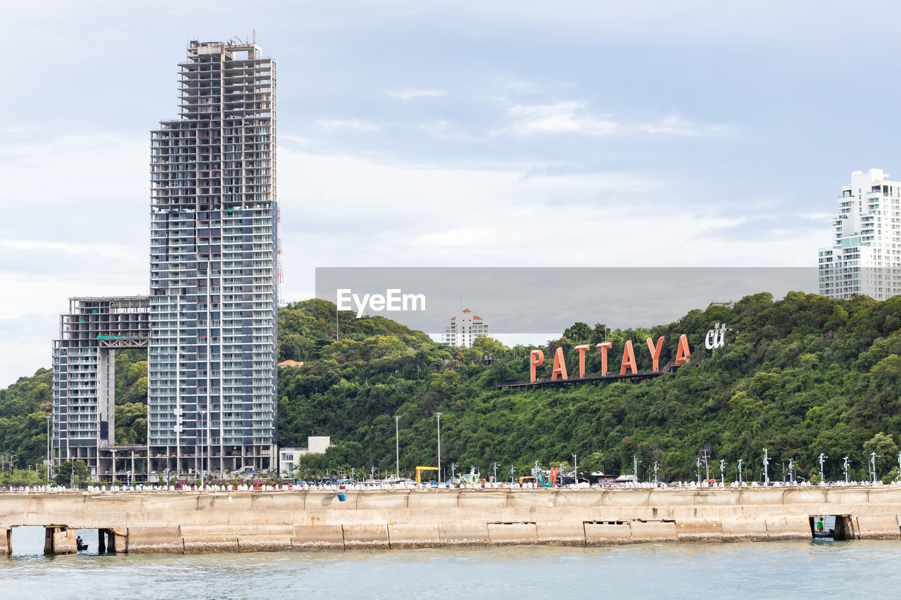 VIEW OF BUILDINGS BY RIVER