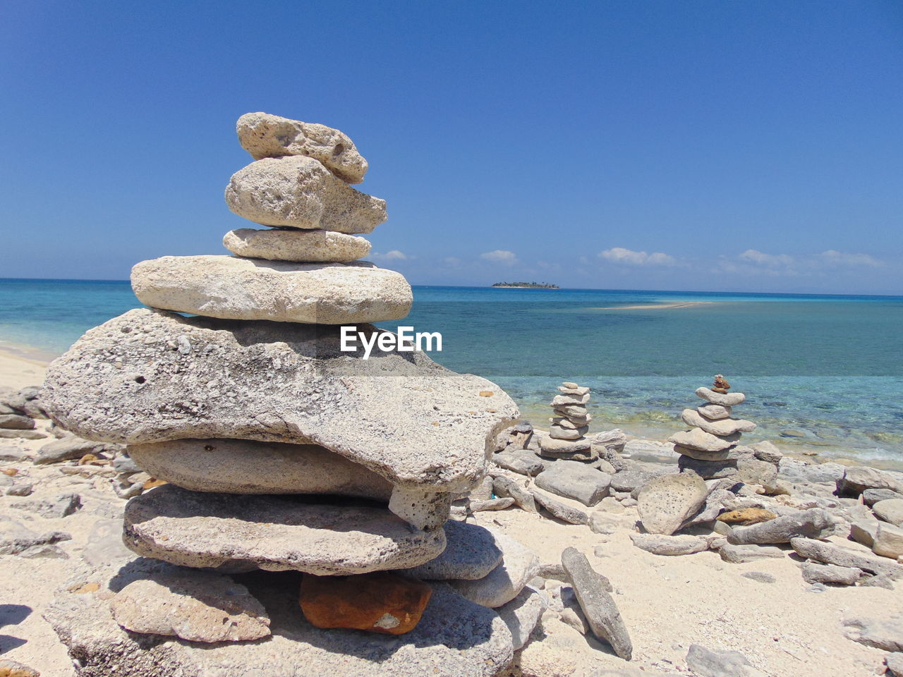 STACK OF PEBBLES ON SHORE