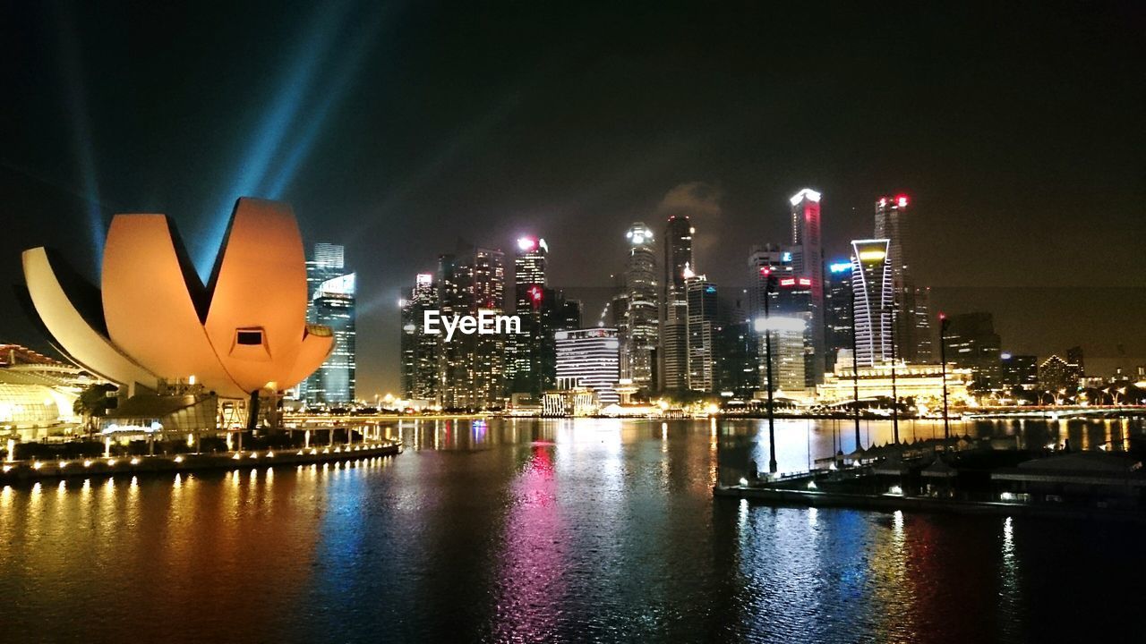 Artscience museum in illuminated city at night