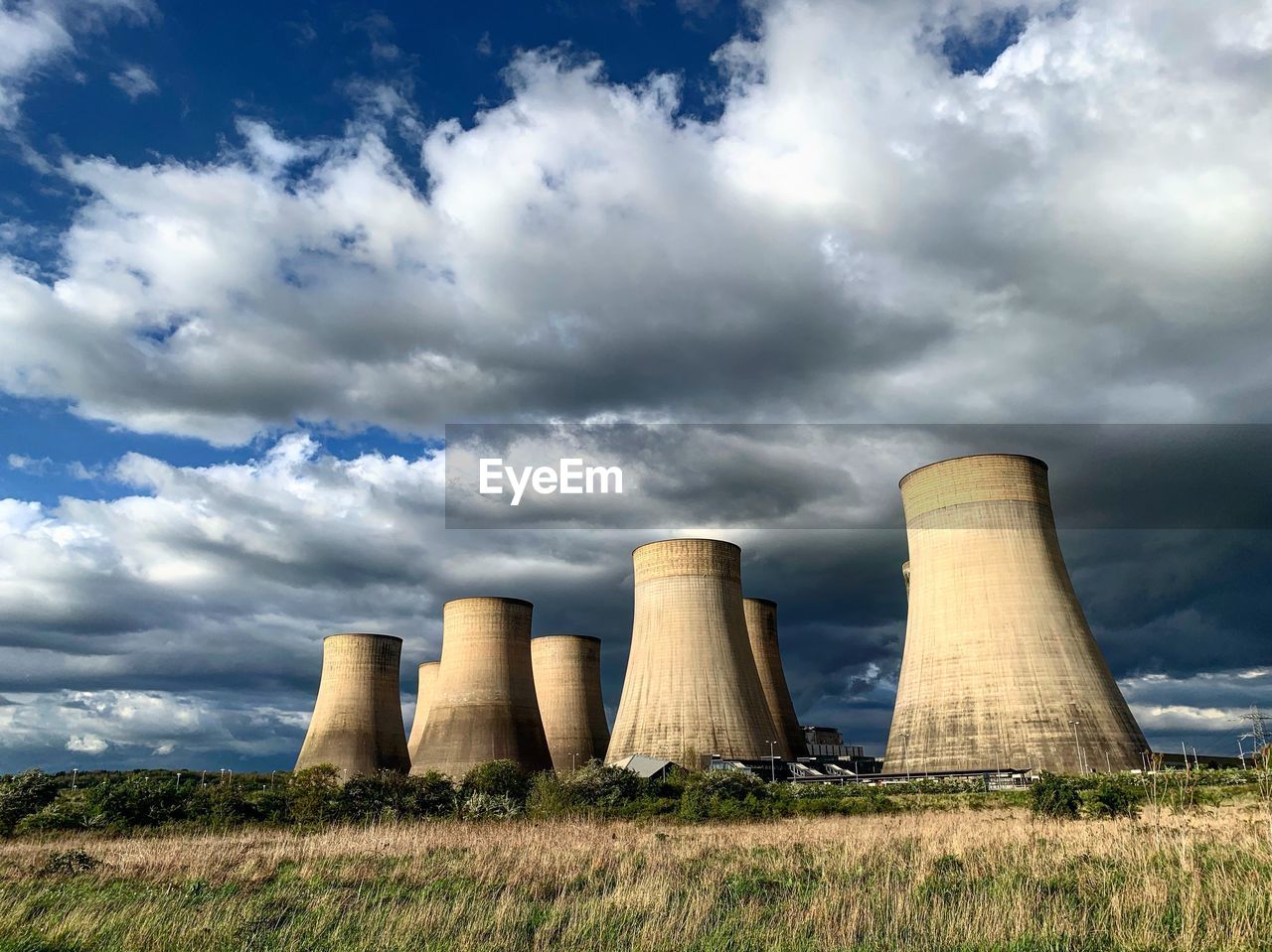 View of cooling towers against blue and  cloudy sky. ratcliffe on soar, coal fired power station.
