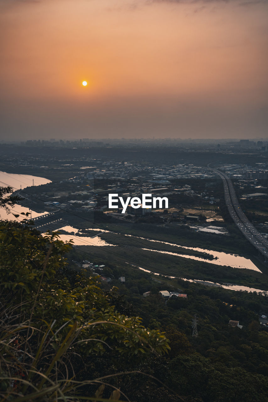 High angle view of townscape against sky during sunset